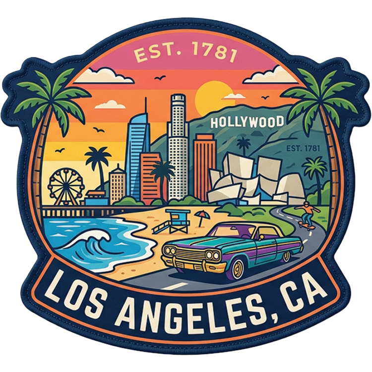 Los Angeles hat patch: shield-shaped patch with the downtown LA skyline, palm trees, a hillside sign, a ferris wheel, a wave, and a purple lowrider on the road, lettered Los Angeles, CA